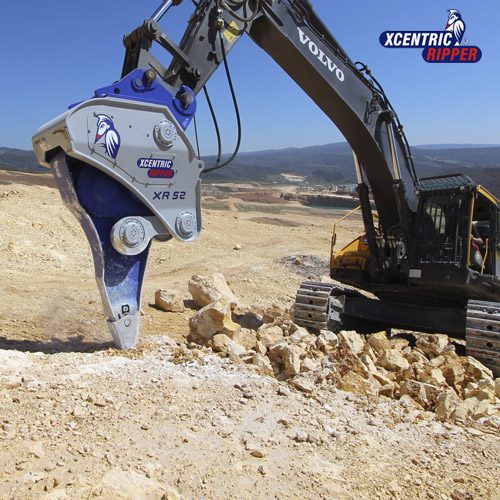 Xcentric Ripper extracting rock in a quarry with a VOLVO excavator. The photo works as a button to open the information about this excavator attachment
